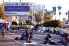 Homeless people settle in at a Las Vegas parking lot.