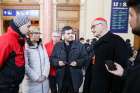 Canadian Cardinal Michael Czerny, interim president of the Dicastery for Promoting Integral Human Development, talks with people during a visit to meet with Ukrainian refugees arriving at the Keleti train station in Budapest, Hungary, March 8, 2022.
