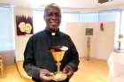 Fr. Alex Osei shows one of the chalices bound for a mission.
