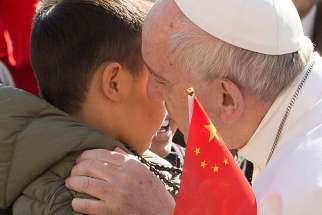 Pope Francis shared a moment with some Chinese pilgrims during his general audience March 15 who broke protocol to approach him.