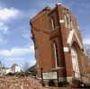 Part of the front of St. Joseph&#039;s Catholic Church remains standing Feb. 29 after a tornado ripped through Ridgway, Ill. Homes, churches and businesses were destroyed by multiple tornadoes in six states. At least 12 people were killed in the violent storms.
