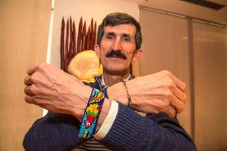 Fr. Jesus Alberto Franco wears two bracelets as reminders of the marginalized Colombian people.