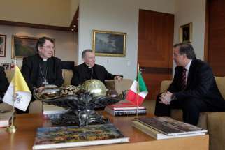 Mexican Foreign Minister Jose Antonio Meade Kuribrena meets with Cardinal Pietro Parolin, Vatican secretary of state, in Mexico City July 13. Cardinal Parolin, shown with Archbishop Christophe Pierre, apostolic nuncio to Mexico, traveled to Mexico to di scuss the issue of child migrants from Central America with regional counterparts.