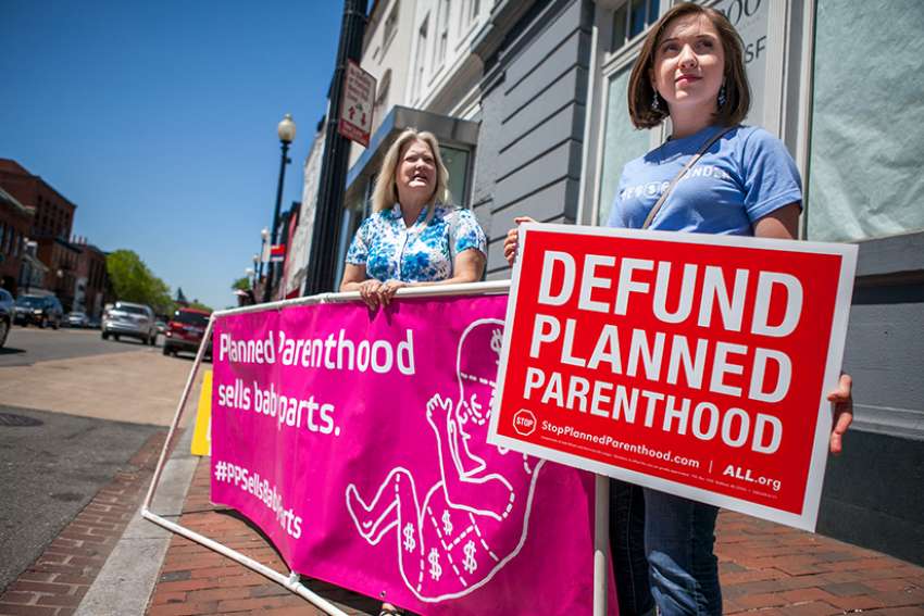 Pro-life protesters stand outside a Planned Parenthood in Washington, D.C. 