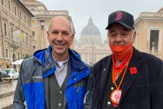 Archbishop Donald Bolen of Regina, Saskatchewan, is pictured with Ted Quewezance, former chief of Keeseekoose First Nation and a residential school survivor, near the Vatican in Rome March 30, 2022. Canadian Indigenous delegations are in Rome for meetings with Pope Francis.