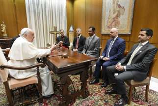 Pope Francis meets Sultan al-Jaber, the president-designate of the 2023 United Nations Climate Change Conference, known as COP28, his delegation and Cardinal Miguel Ángel Ayuso Guixot, prefect of the Dicastery for Interreligious Dialogue, at the Vatican Oct. 11, 2023. COP28 is set to open Nov. 30 in Dubai.