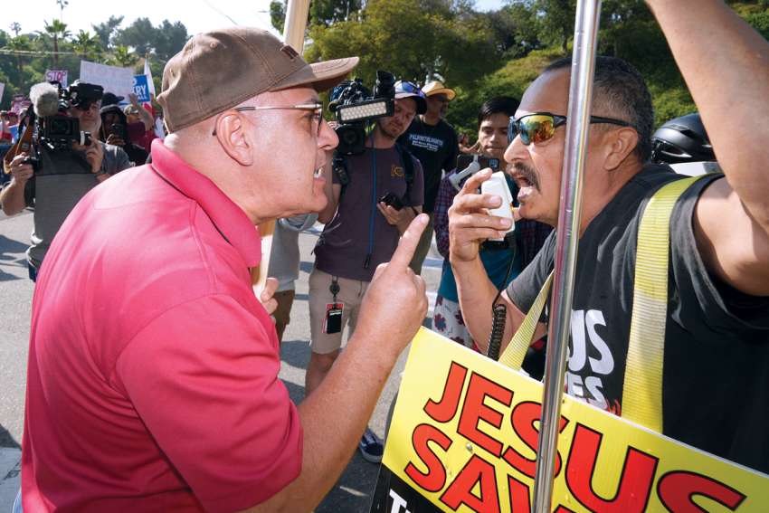 A face off between a Christian protester and an opponent outside Dodger Stadium June 16. Protesters had gathered near the venue as the Los Angeles Dodgers prepared to honor the pro-LGBTQ+ group Sisters of Perpetual Indulgence during Pride Night.