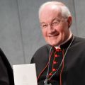 Canadian Cardinal Marc Ouellet, prefect of the Congregation for Bishops, holds a copy of Pope Francis&#039; first encyclical, &quot;Lumen Fidei&quot; (&quot;The Light of Faith&quot;), during a news conference for its release at the Vatican July 5.