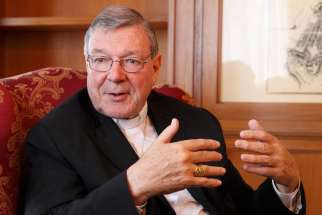 Cardinal George Pell, prefect of the Vatican Secretariat for the Economy, gestures during an interview at the Vatican in this Aug. 5, 2014 file photo.