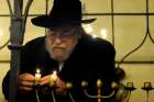 Czech Rabbi Karol Efraim Sidon lights the menorah of Hanukkah inside Europe&#039;s oldest active synagogue, The Old New Synagogue, in Prague, Czech Republic, in this Dec. 2, 2010, file photo. Although Catholics are called to witness to their faith, the church &quot;neither conducts nor supports&quot; any institutional missionary initiative directed toward Jews, according to a new document from a Vatican commission