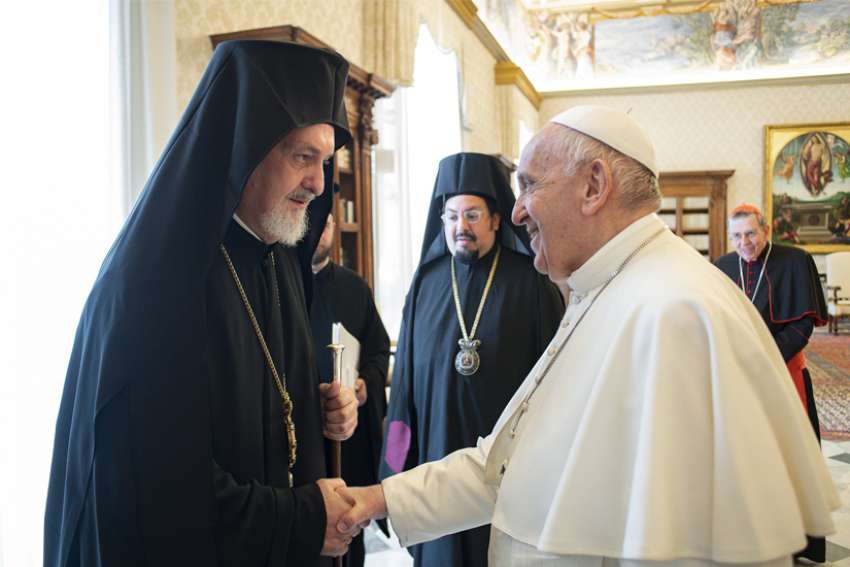 Pope Francis greets Orthodox Metropolitan Emmanuel of France during an audience with a delegation from the Ecumenical Patriarchate of Constantinople at the Vatican June 28, 2021.