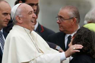 Pope Francis laughs as he greets members of his general audience at St. Peter&#039;s Square at the Vatican Oct. 2017.