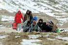 A group of migrants from Syria, Iraq and Afghanistan, on their way to seek asylum in Germany or Austria, walk along the frozen route from the border between Serbia and Macedonia to a temporary camp for migrants. The Archdiocese of Toronto has applied to sponsor another 4,000 refugees this year. 