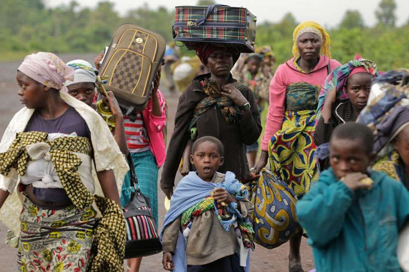 Villagers walk toward Goma, Congo, to flee regional fighting in 2012. Bishops from eastern Congo criticized the failure of their government and the United Nations to act against Ã¬genocide, jihadist fundamentalism and Balkanization&quot; in the country. 