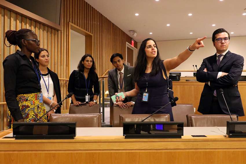Anna Fata, attache at the Vatican&#039;s Permanent Observer Mission to the United Nations, gestures as she leads mission interns on a tour of the U.N. campus Sept. 6. Looking on are Mary Goretti Byamugisha, left, Giulia Iop, Reyna Anderson, Juan Daray and Alexander MacDonald.