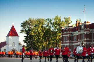 RCMP conduct the Sunset Retreat Ceremony in front of the RCMP chapel in Regina, Sask.