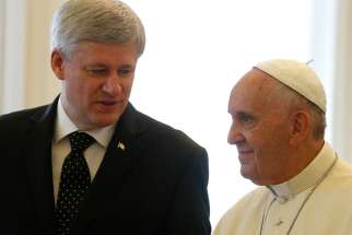 Pope Francis meets with Prime Minister Stephen Harper during a private audience in the Apostolic Palace at the Vatican June 11.