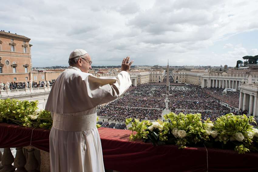 Pope Francis greets the crowd during his Easter message and blessing &quot;urbi et orbi&quot; (to the city and the world) delivered from the central balcony of St. Peter&#039;s Basilica at the Vatican April 1. 