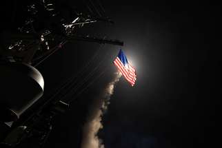 The USS Porter, in the Mediterranean Sea, fires a Tomahawk missile April 7. The U.S. Defense Department said it was a part of missile strike against Syria.