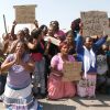 Women protest outside the Lonmin platinum mine Aug. 17, the day after South African police opened fire on striking miners outside the facility in Marikana, South Africa.