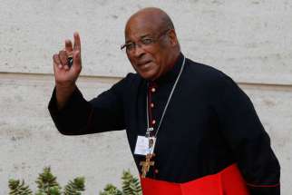 Cardinal Wilfrid F. Napier of Durban, South Africa, arrives for the morning session of the extraordinary Synod of Bishops on the family at the Vatican Oct. 14. In a series of tweets, Napier says abortion rates among blacks in the U.S. is &quot;a genocide.&quot;