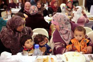 Evacuees from besieged towns in Syria rest at Ebla Hotel in Damascus Dec. 30.