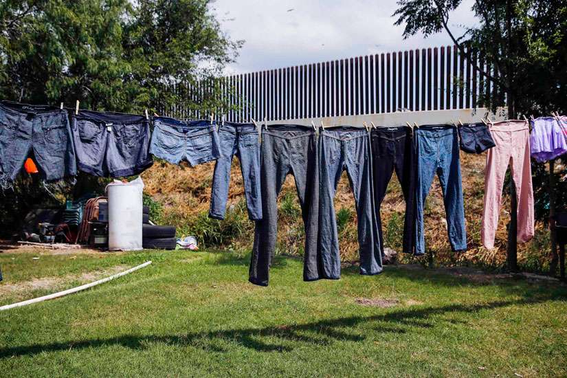 lothes dry in the backyard of a home facing a U.S.-Mexico border fence near Brownsville, Texas, Aug. 5. U.S. and Central American leaders continue to work on approaches to address the situations driving Central Americans to seek refuge in the U.S.