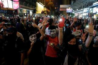 Anti-government demonstrators protest in Hong Kong Oct. 27, 2019. As protests pitting pro-government groups against pro-democracy protesters continue, a bishop urged Catholics to pray for the realization that all are humans and not &quot;cockroaches or dogs.&quot;