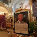 A poster with an image of former South African President Nelson Mandela is displayed during a special prayer service in his honor at the Holy Family Church in the West Bank city of Ramallah Dec. 8. People around the world paid tribute to the anti-aparthe id hero, who died Dec. 5 at age 9 5 at his Johannesburg home.