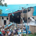 People gather near the damaged Shalom Church in the northern Nigerian city of Kaduna June 17. Bombings at three churches, including Zaria&#039;s Cathedral of Christ the King, killed at least 45 people and wounded others, triggering retaliatory attacks by Christian youths.