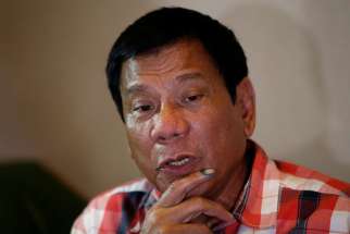 Philippine President-elect Rodrigo Duterte talks to reporters May 9 in Davao City.