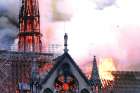 Flames and smoke billow from Notre Dame Cathedral in Paris April 15, 2019.