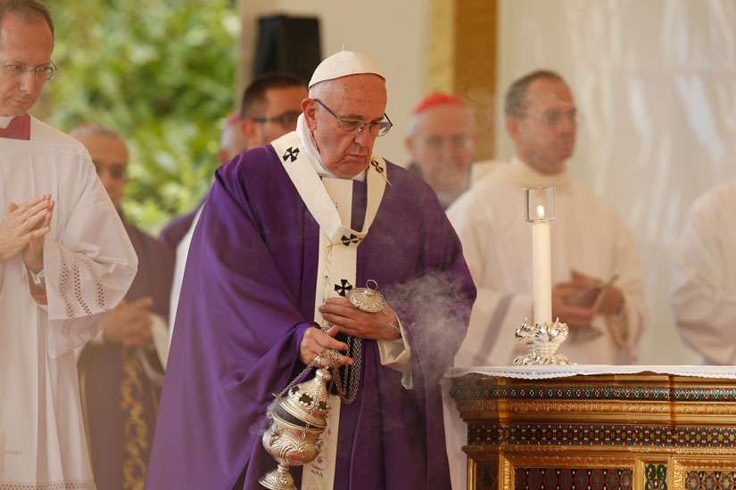 ope Francis uses incense as he celebrates Mass in Rome&#039;s Prima Porta cemetery Nov. 2, the feast of All Souls.
