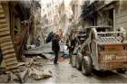 Syrian citizens clear streets in late April after shelling in Aleppo. Chaldean Catholic Bishop Antoine Audo of Aleppo says Christians are losing hope, but not faith, as fighting continues.
