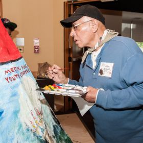 Hilton Henhawk was one of many volunteer artists who contributed to a painted teepee as the Truth and Reconciliation Commission came to Toronto May 31-June 1. 