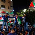 Palestinians celebrate as they take part in a rally in the West Bank city of Ramallah Nov. 29. The U.N. General Assembly approved a resolution Nov. 29 to grant Palestine observer status, implicitly recognizing a Palestinian state.