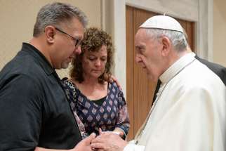 ope Francis talks with Nick and Jodi Solomon, parents of U.S. student Beau Solomon, during a private meeting at the Vatican July 6. Solomon, a native of Spring Green, Wis., was found dead in the Tiber River in Rome July 4. A homeless man was detained as a suspect in the death.
