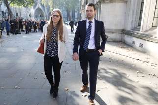 Daniel and Amy McArthur, owners of Ashers bakery in Belfast, Northern Ireland, leave the Supreme Court in London Oct. 10. The court upheld their right to refuse to make a cake emblazoned with a slogan in support of same-sex marriage. 