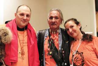 Cree residential school survivor Don Tourangeau, centre, at St. Joseph the Worker Parish in Richmond, B.C., with pastor Fr. Pierre Ducharme and friend and parishioner Rhonda Caris. About 250 people listened to Tourangeau share his story as a residential school survivor.