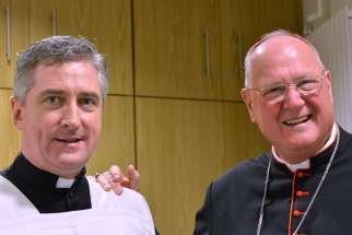 Cardinal Timothy M. Dolan of New York poses for a photo with Father Richard Gibbons, parish priest of Knock Shrine in County Mayo, Ireland, Aug. 14. 