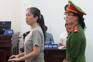  Vietnamese blogger Nguyen Ngoc Nhu Quynh, who is known as &quot;Mother Mushroom,&quot; stands during her 2017 trial in Nha Trang. Vietnam has freed the well-known Catholic blogger and rights activist jailed two years ago for posting anti-government material on social media and forced her into exile in the United States. 