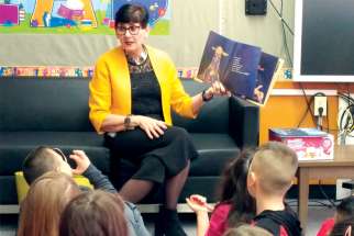 Joan Carr reads to students at St. Gerard School in north Edmonton.