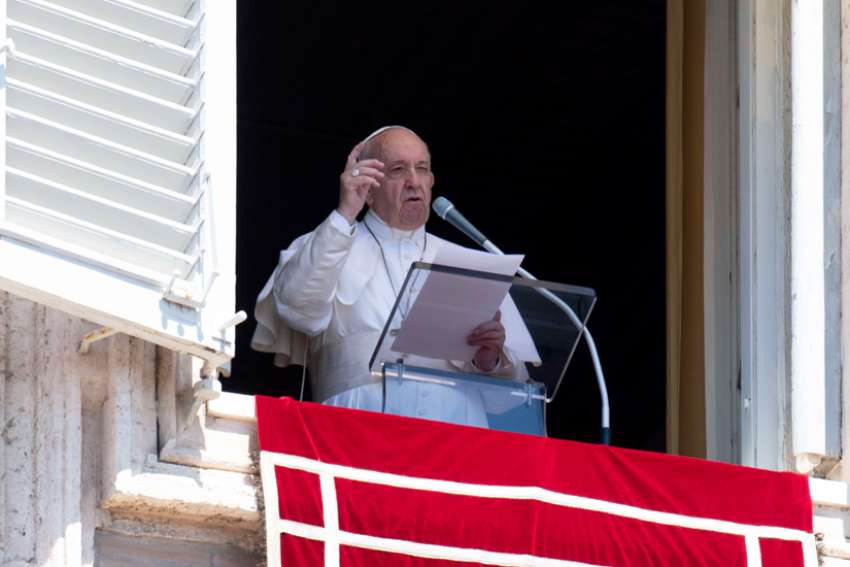 Pope Francis speaks as he leads the Angelus from the window of his studio overlooking St. Peter&#039;s Square at the Vatican.
