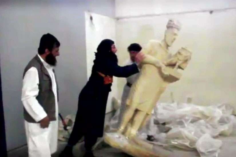 Members of the Islamic State destroy ancient artifacts in Iraq.