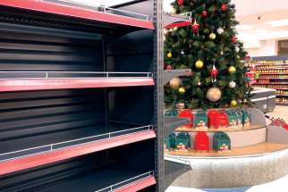 Empty shelves in the shadow of a Christmas tree in a shop in the heavily-Armenian area of Artsakh.