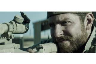 Bradley Cooper as Chris Kyle in Warner Bros. Pictures’ and Village Roadshow Pictures’ drama “American Sniper.”