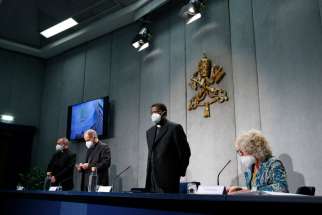 Leaders of the Congregation for the Evangelization of Peoples hold a news conference at the Vatican Oct. 16, 2020. The topic was World Mission Sunday, which will be observed Oct. 18. Pictured from left are Oblate Father Tadeusz J. Nowak, secretary-general of the pontifical mission societies; Archbishop Giampietro Dal Toso, adjunct secretary of the Congregation for the Evangelization of Peoples; Archbishop Protase Rugambwa, secretary of the Congregation for the Evangelization of Peoples; and Cristiane Murray, vice director of the Vatican Press Office.