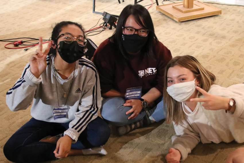 Monica Palacios, left, Pia Ocenar and Theresa Henry were among the 46 young Catholics who spent five weeks at the Sanctum Retreat Centre learning how to become NET Canada missionaries. Health and safety protocols did not dim the orientation experience.
