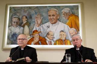Auxiliary Bishop Fernando Ramos Perez of Santiago, Chile, and Bishop Juan Ignacio Gonzalez Errazuriz of San Bernardo, Chile, lead a press conference at the Vatican May 14. Pope Francis is meeting this week with Chile&#039;s bishops in the wake of a clerical sex abuse crisis. 