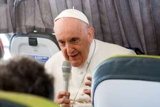 Pope Francis answers questions from journalists aboard his flight back to Rome from Lisbon, Portugal, Aug. 6, 2023, after his participation in World Youth Day.